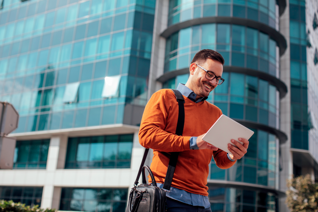 Momentum_Successful_Modern_Young_Businessman_Using_a_Digital_Tablet_on_the_Street-low-res.png